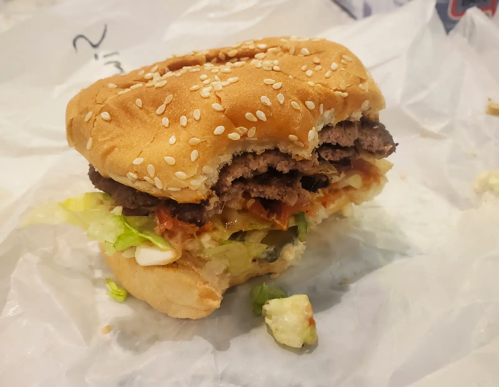 a half-eaten burger from Fritz's
